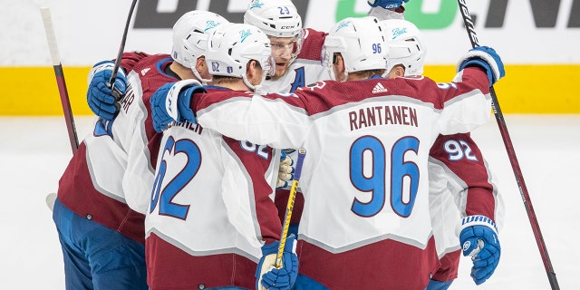 Colorado Avalanche's Nathan MacKinnon (29), Gabriel Landeskog (92), Mikko Rantanen (96), Artturi Lehkonen (62) and Cale Makar (8) celebrate a goal against the Edmonton Oilers during the first period of Game 4 of the NHL hockey Stanley Cup playoffs Western Conference finals in Edmonton, Alberta, Monday, June 6, 2022.