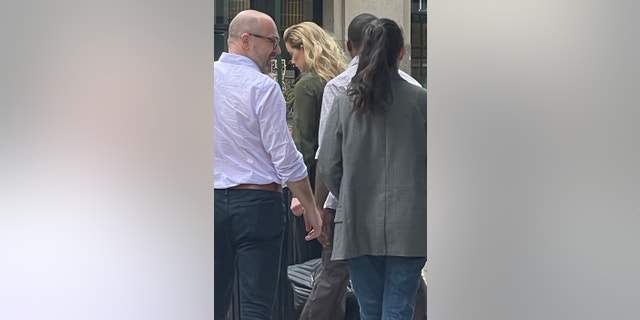 The actress made her way through the streets of New York carrying a black Yves Saint Laurent purse.