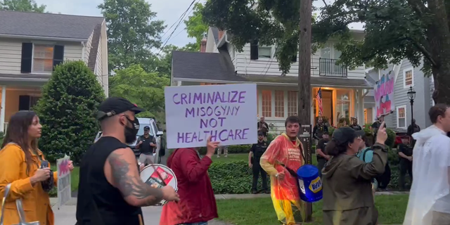 Protestors and drummers marched outside of Supreme Court Justice Brett Kavanaugh's house after an alleged assassination attempt.