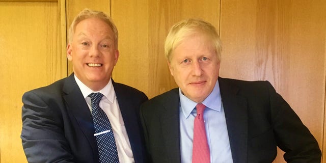 Royal expert Neil Sean and Prime Minister Boris Johnson. 