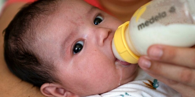 An infant is given a bottle of formula. It's not only babies that need access to formula, a trade association spokesperson told Fox News Digital.