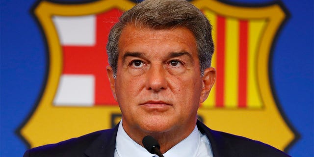 FC Barcelona club President Joan Laporta pauses during a news conference in Barcelona, Spain, on Aug. 6, 2021. Spain Barcelona’s members late on Thursday approved a plan to sale part of its television rights and future revenues from merchandise and licensing in hopes of injecting an immediate 600 million euros ($631 million) into the debt-ridden Spanish club.