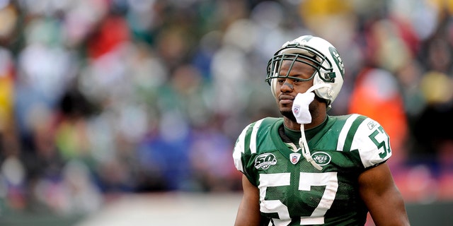 Bart Scott #57 of the New York Jets looks on against the Buffalo Bills at Giants Stadium on October 18, 2009 in East Rutherford, New Jersey. The Bills defeated the Jets 16-13 in overtime.