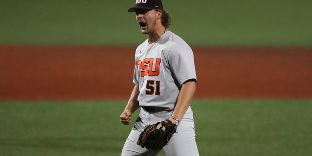 Oregon State pitcher Ben Ferrer celebrates his team's 4-3 win over Auburn in an NCAA college baseball tournament super regional game on Sunday, June 12, 2022, in Corvallis, Ore.