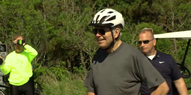 President Biden cracked a smile after falling from his bike in Rehoboth Beach, Delaware, Saturday, June 18, 2022.