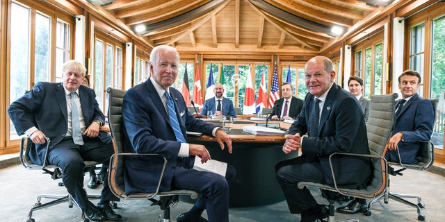 U.S. President Joe Biden, center, attends a working lunch with other G7 leaders to discuss shaping the global economy in Castle Elmau, in Elmau, Germany, Sunday, June 26, 2022. (Kenny Holston/The New York Times via AP, Pool)