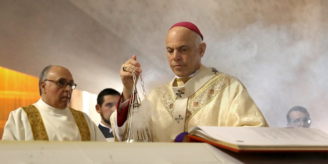 Archbishop of San Francisco, the Most Reverend Salvatore J. Cordileone leads the prayer of commendation during the funeral Mass of archbishop emeritus and Cardinal William Joseph Cardinal Levada at the Cathedral of Saint Mary on Thursday, Oct. 24, 2019, in San Francisco. (Liz Hafalia/The San Francisco Chronicle via Getty Images)