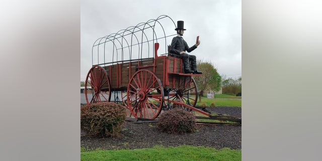 During his trip, Barnes passed the world's largest covered wagon, shown here in Lincoln, Illinois. 