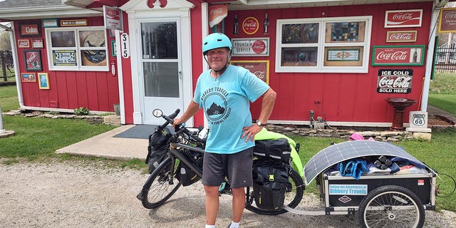 Barnes and his bicycle are pictured at Tom's shop on Route 66. 