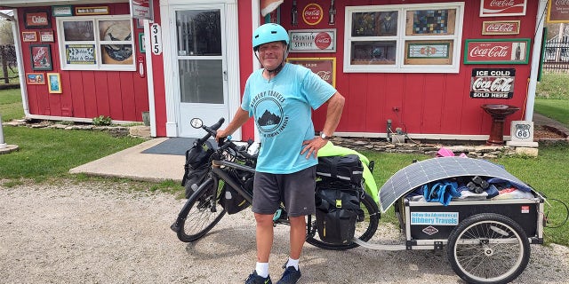 Barnes and his bicycle are pictured at Tom's shop on Route 66. 