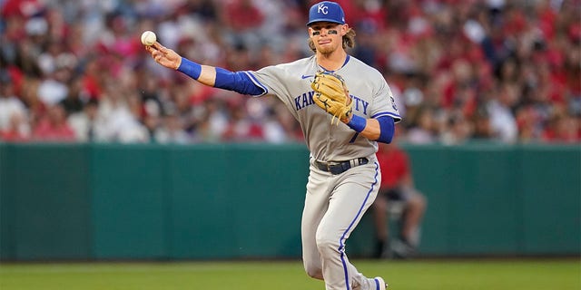 Kansas City Royals shortstop Bobby Witt Jr (7) throws to first dismissal during the third inning of a baseball game in Anaheim, Calif., Wednesday, June 22, 2022, to Andrew Velazquez of the Los Angeles Angels. 
