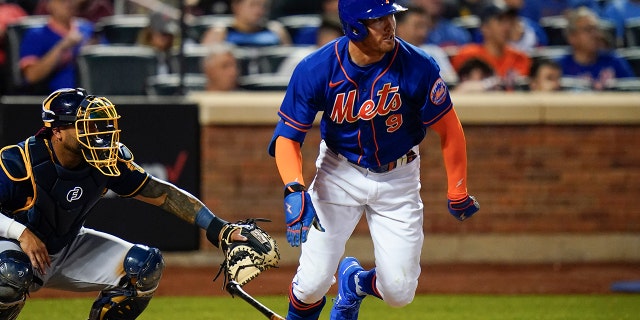 New York Mets' Brandon Nimmo watches his single against the Milwaukee Brewers during the fifth inning of a baseball game Tuesday, June 14, 2022, in New York. The Mets won 4-0.