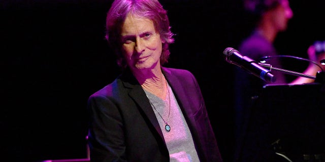The 70-year-old musician died on Sunday following complications from cancer. He was pictured at a 'Music Strong' benefit in Thousand Oaks, Calif. in 2019