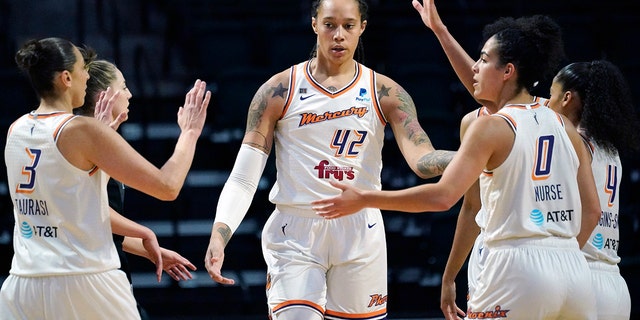 FILE - Phoenix Mercury's Brittney Griner (42) is congratulated on a play against the Seattle Storm in the first half of the second round of the WNBA basketball playoffs Sunday, Sept. 26, 2021, in Everett, Wash.