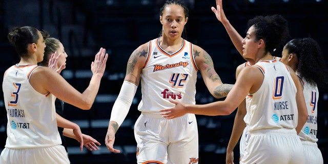 Phoenix Mercury's Brittney Griner (42) is congratulated on a play against the Seattle Storm in the first half of the second round of the WNBA basketball playoffs Sunday, Sept. 26, 2021, in Everett, Wash.