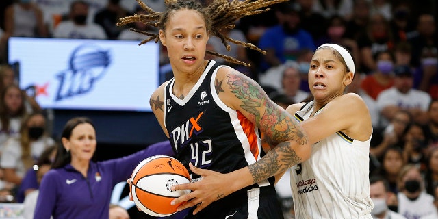 FILE - Phoenix Mercury center Brittney Griner (42) drives past Chicago Sky forward Candace Parker (3) during the first half of Game 1 of the WNBA basketball Finals, Sunday, Oct. 10, 2021, in Phoenix.