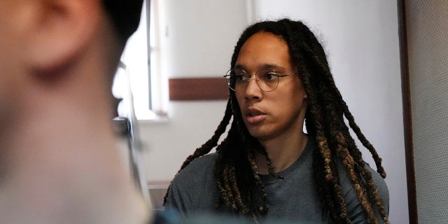 WNBA star and two-time Olympic gold medalist Brittney Griner is escorted to a courtroom for a hearing, in Khimki just outside Moscow, Russia, Monday, June 27, 2022.