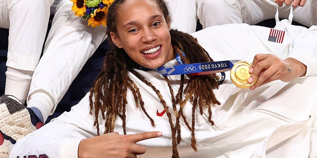 Brittney Griner of the United States poses for a photograph with her gold medal in Women's Basketball at the Tokyo 2020 Summer Olympics at the Saitama Super Arena in Saitama, Japan, August 8, 2021.  Picture taken August 8, 2021.