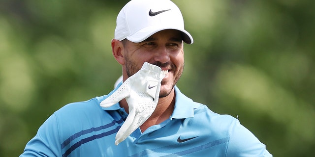  Brooks Koepka of the United States smiles on the eighth tee during a practice round prior to the 2022 U.S. Open at The Country Club on June 13, 2022 in Brookline, Massachusetts.
