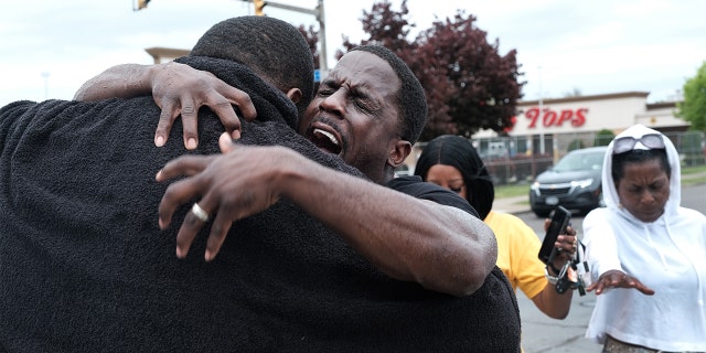 Evangelist Bruce Warrick performs a baptism outside of Tops grocery store on May 20, 2022 in Buffalo, New York. (Photo by Spencer Platt/Getty Images)