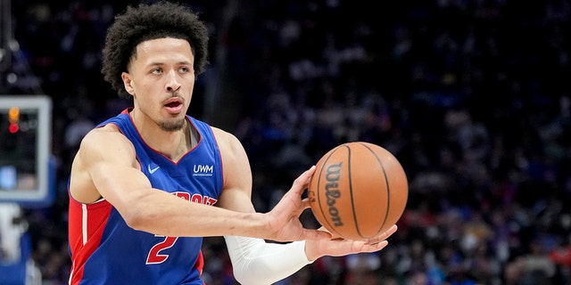 Cade Cunningham #2 of the Detroit Pistons passes the ball against the Milwaukee Bucks during the second quarter at Little Caesars Arena on April 08, 2022 in Detroit, Michigan.