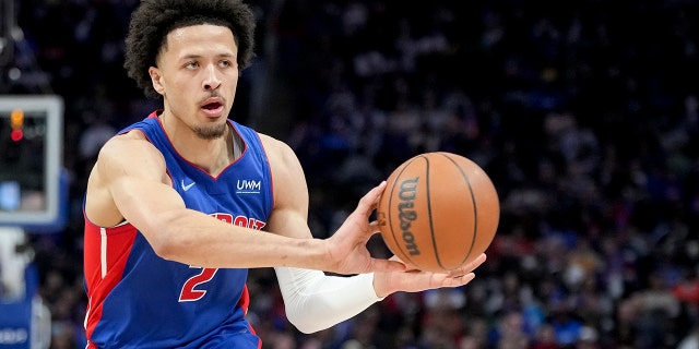 Cade Cunningham #2 of the Detroit Pistons passes the ball against the Milwaukee Bucks during the second quarter at Little Caesars Arena on April 08, 2022 in Detroit, Michigan.