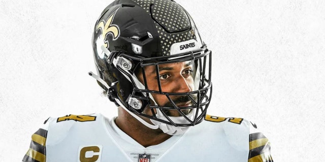 Cam Jordan models the new Saints helmet.