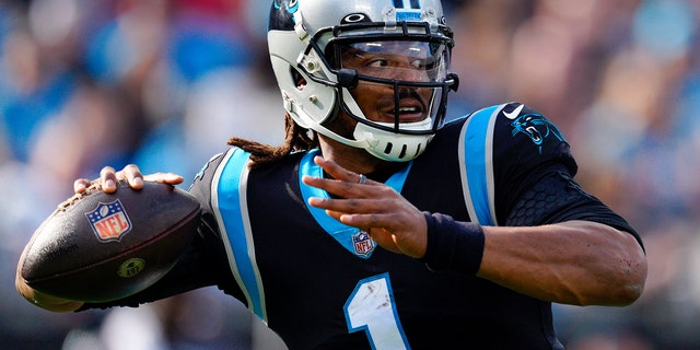 Panthers quarterback Cam Newton passes against the Tampa Bay Buccaneers on Dec. 26, 2021, in Charlotte.