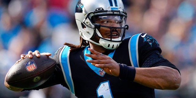 Panthers quarterback Cam Newton passes against the Tampa Bay Buccaneers on Dec. 26, 2021, in Charlotte.