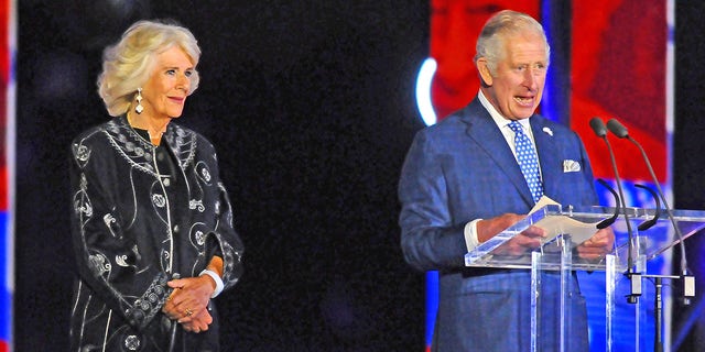 Camilla, Duchess of Cornwall, and Prince Charles are seen on stage during the Platinum Party at The Palace at Buckingham Palace June 4, 2022, in London.