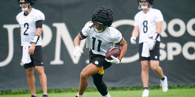 Steelers wide receiver Chase Claypool runs after catching a pass during a practice drill, June 7, 2022, in Pittsburgh.