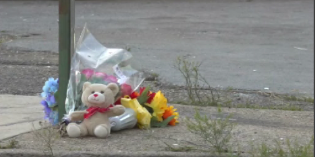 A memorial is set up near the scene of a shooting in Chattanooga, Tennessee, that left three people dead and 14 others injured.