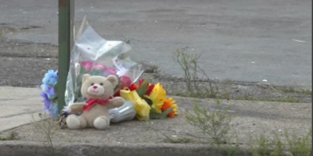 A memorial is set up near the scene of a shooting in Chattanooga, Tennessee, that left three people dead and 14 others injured.