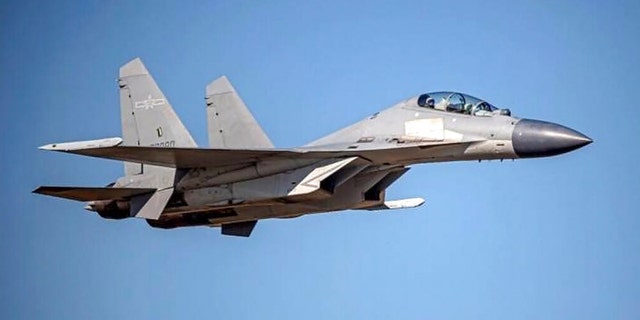FILE: In this undated file photo released by the Taiwan Ministry of Defense, a Chinese PLA J-16 fighter jet flies in an undisclosed location. 
