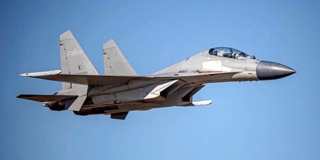 FILE: In this undated file photo released by the Taiwan Ministry of Defense, a Chinese PLA J-16 fighter jet flies in an undisclosed location.