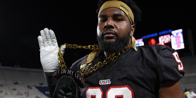 Chris Odom of the Houston Gamblers shows off his necklace in the third quarter of a game against the New Orleans Breakers at Legion Field June 19, 2022, in Birmingham, Ala.