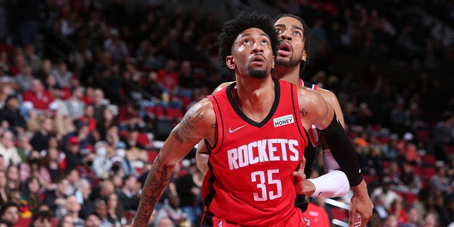 Christian Wood #35 of the Houston Rockets looks for the rebound during the game against the Portland Trail Blazers on March 26, 2022 at the Moda Center Arena in Portland, Oregon. 