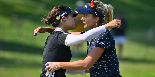 In Gee Chun, of South Korea, left, hugs Lexi Thompson after Chun won the KPMG Women's PGA Championship golf tournament at Congressional Country Club, Sunday, June 26, 2022, in Bethesda, Md. 