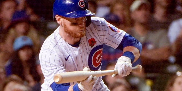 The Chicago Cubs' Clint Frazier bunts against the Milwaukee Brewers May 30, 2022, at Wrigley Field in Chicago.