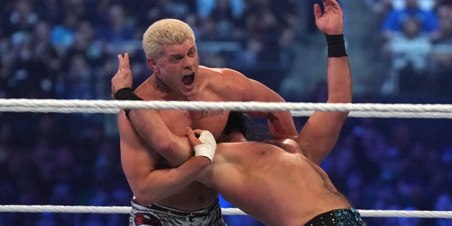 Cody Rhodes and Seth Rollins wrestle during WrestleMania at Arlington, Texas, April 2, 2022.