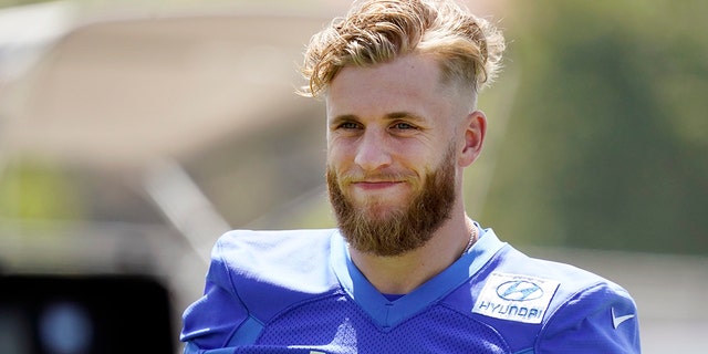 Los Angeles Rams wide receiver Cooper Kupp smiles during stretching at the team's practice facility May 26, 2022, in Thousand Oaks, Calif.