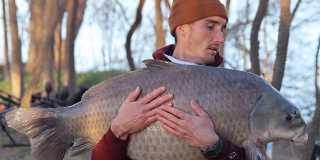 Cassady Douglas, 29, of Austin, Texas, caught a 64-pound smallmouth buffalo in Lady Bird Lake in Austin earlier this year. 