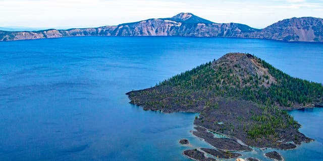 Crater Lake National Park, Oregon, is one of America's oldest national parks. Wizard Island, Crater Lake, from Discovery Point. 