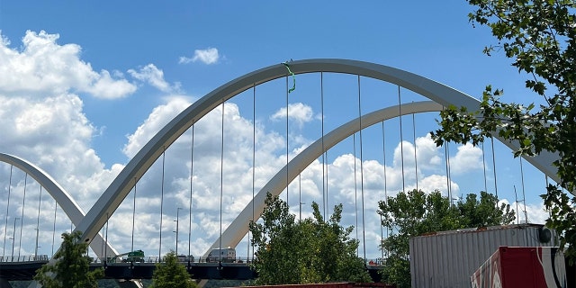 Pro-choice protester Guido Reichstadter atop the Frederick Douglass Bridge in Washington, D.C., Saturday, June 25, 2022.