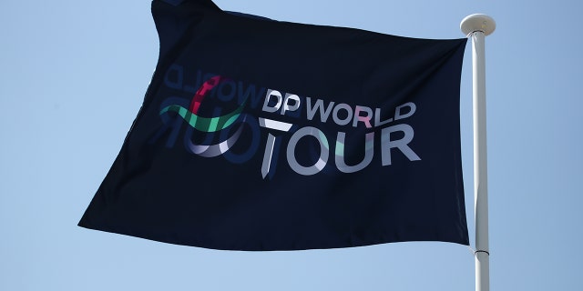 A DP World Tour flag flies over the Slync.io Dubai Desert Classic at Emirates Golf Club on Jan. 26, 2022, in Dubai, United Arab Emirates.