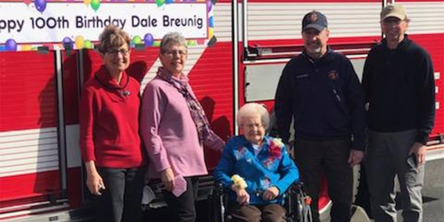 All four of Breunig's children (pictured) went with her on the fire truck as they rode through Sauk City, Wisconsin. 