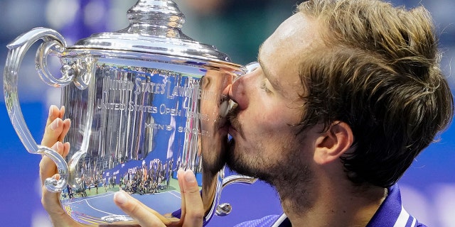 FILE - Daniil Medvedev, of Russia, kisses the championship trophy after defeating Novak Djokovic, of Serbia, in the men's singles final of the U.S. Open tennis championship.