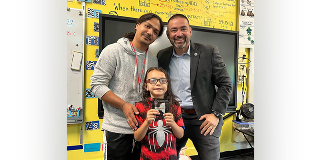 From left to right, David Diaz Sr., David Diaz Jr. (front) and N.Y. State Senator Fred Akshar. The trio posed for a photo at Woodrow Wilson Elementary.