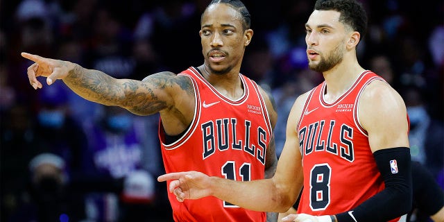 DeMar DeRozan #11 and Zach LaVine #8 of the Chicago Bulls speak during the first quarter against the Philadelphia 76ers at Wells Fargo Center on November 03, 2021 in Philadelphia, Pennsylvania.