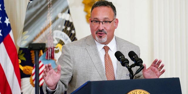 FILE: Education Secretary Miguel Cardona speaks during the 2022 National and State Teachers of the Year event in the East Room of the White House in Washington, April 27, 2022. 